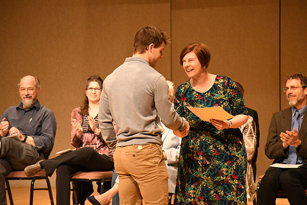 Zach Slone was one of 30 students recognized as a distinguished scholar. He received the award in Studio Art from Dr. Melissa Friesen, communication and fine arts department chair.